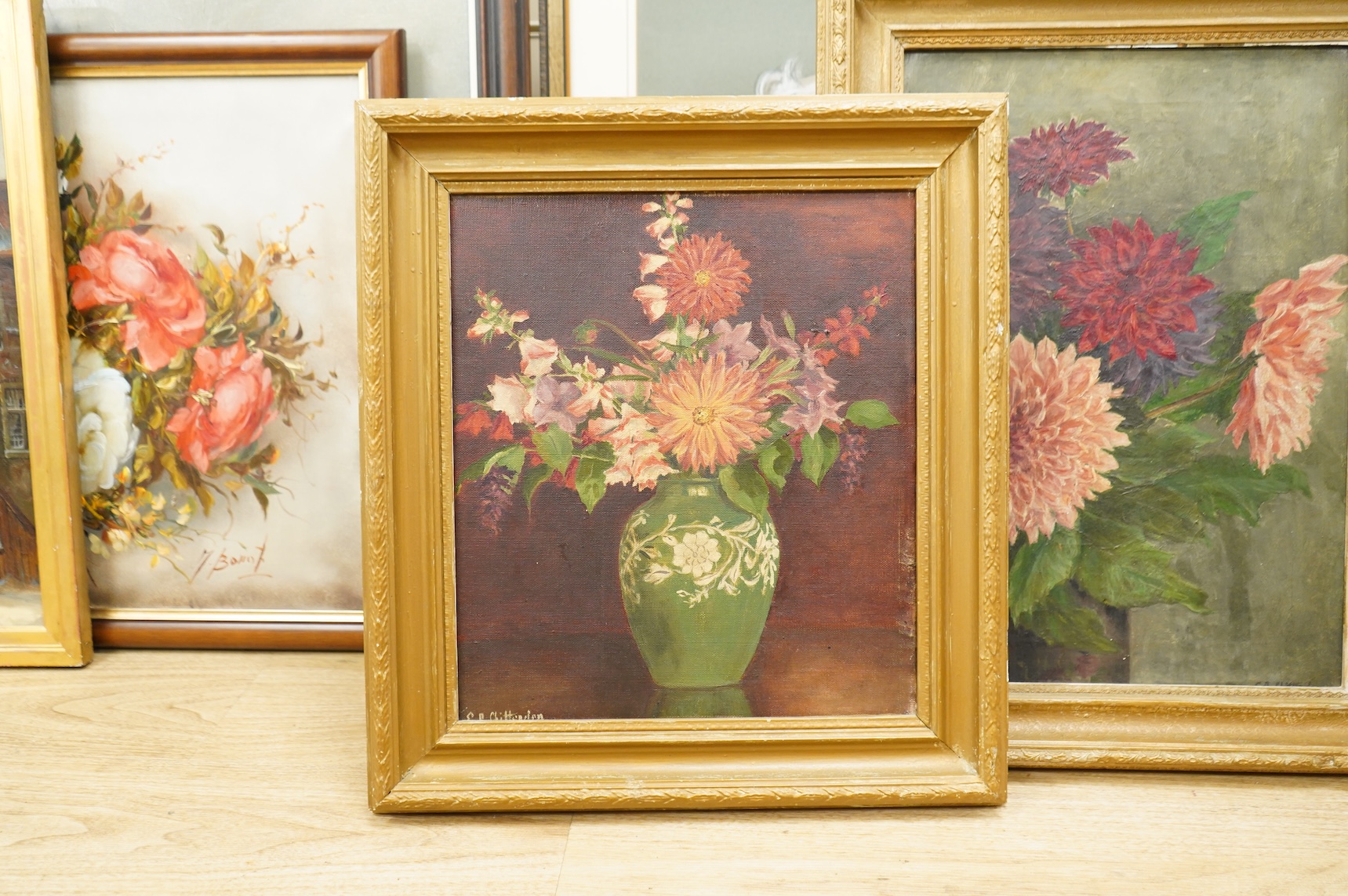 20th century, four still life’s of flowers, each indistinctly signed, oils on canvas, 39 x 34cm